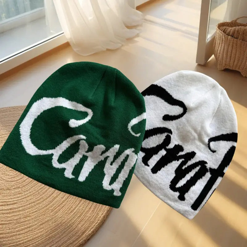 green and white knitted embroidered letter knit beanie hats featuring carat embroidered in contrasting script on the front