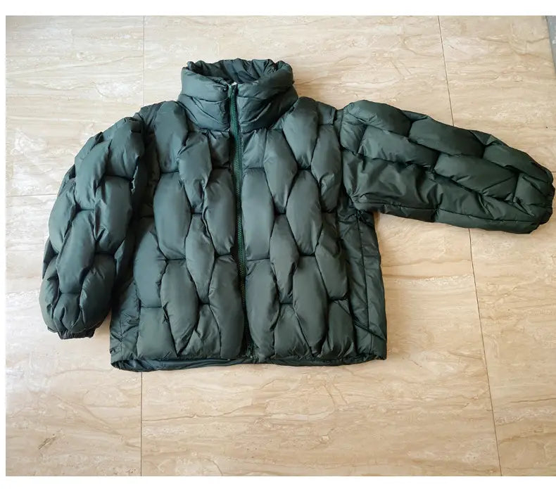 Dark green plus size quilted puffer jacket with high collar and zipper closure designed for warmth and comfort.