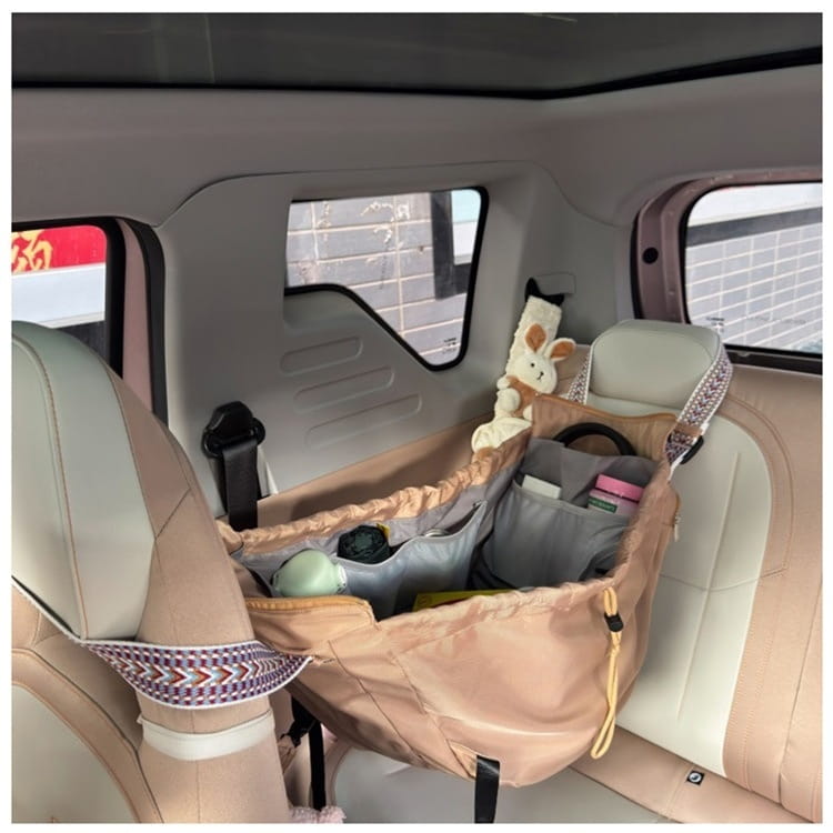 Beige and gray multifunctional waterproof nylon car seat organizer with patterned straps shown from the back side