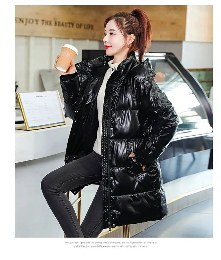 Glossy black plus size puffer jacket featuring a quilted design in shiny fabric ideal for cold weather.