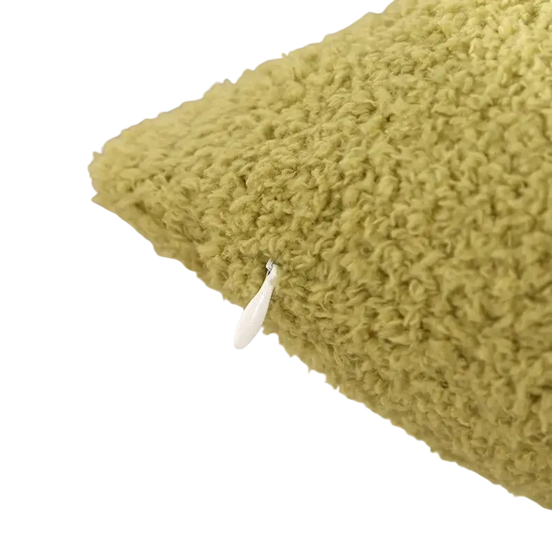 Soft olive-green 60x60cm cushion cover made of teddy velvet with a white zipper pull in pure color design
