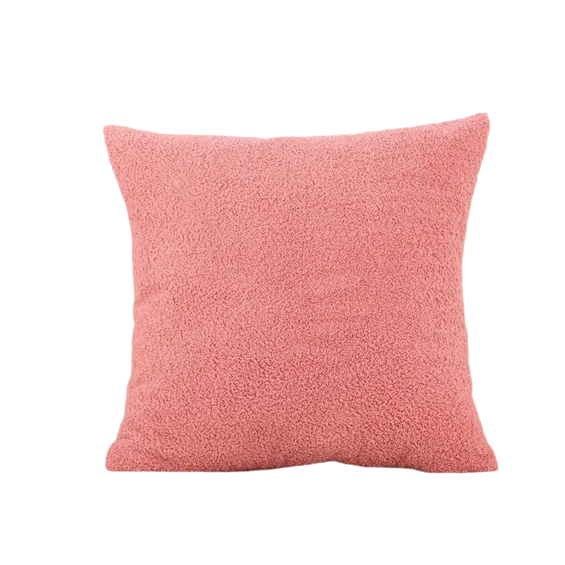 A 60x60cm cushion cover in solid pink teddy velvet with a soft, plush textured surface for decorative use