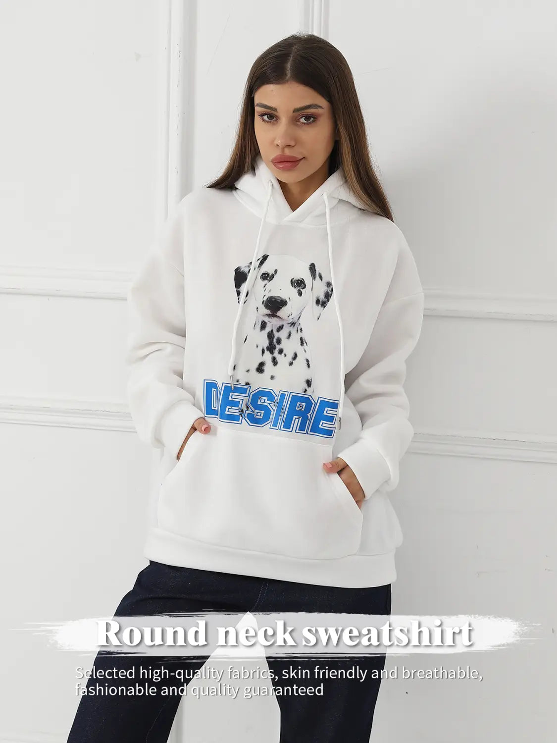 White round-neck sweatshirt with black and white dalmatian graphic and blue desire lettering across the chest designed as a women’s dalmatian print hoodie with cat ear hood.