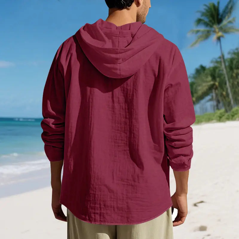 A maroon men linen hooded cardigan shirt made of lightweight textured fabric with long sleeves.