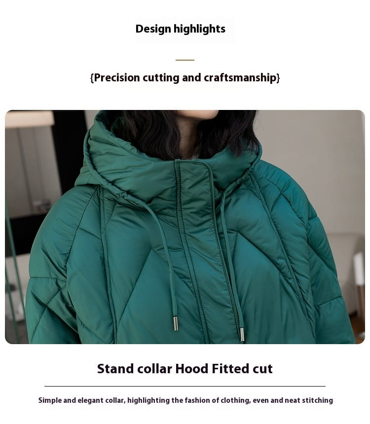 Women mid length padded down jacket in teal with quilted design, stand collar, and hood for winter use.