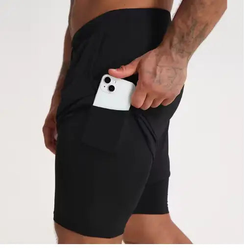 Men’s black 2-in-1 breathable quick dry athletic training shorts with a side pocket holding a white smartphone.