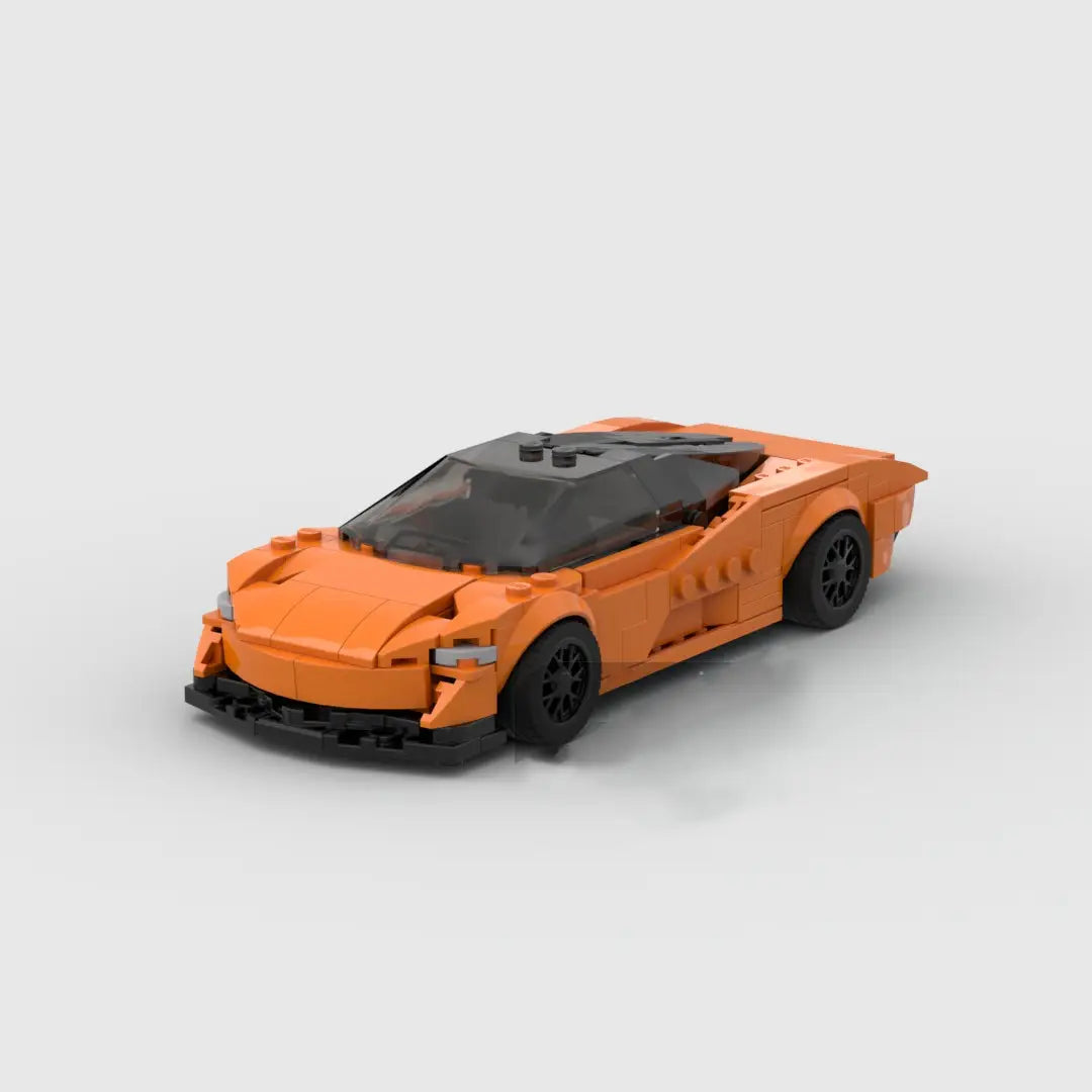 Juguete de coche deportivo de bloques de construcción Orange McLaren Speedtail, que incluye un cuerpo naranja con ruedas negras y un techo transparente.