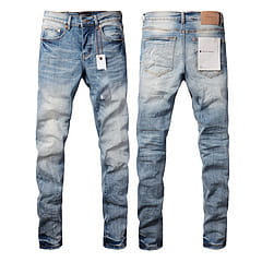 Men’s distressed slim fit patchwork denim jeans in blue with a faded wash and made from denim fabric.
