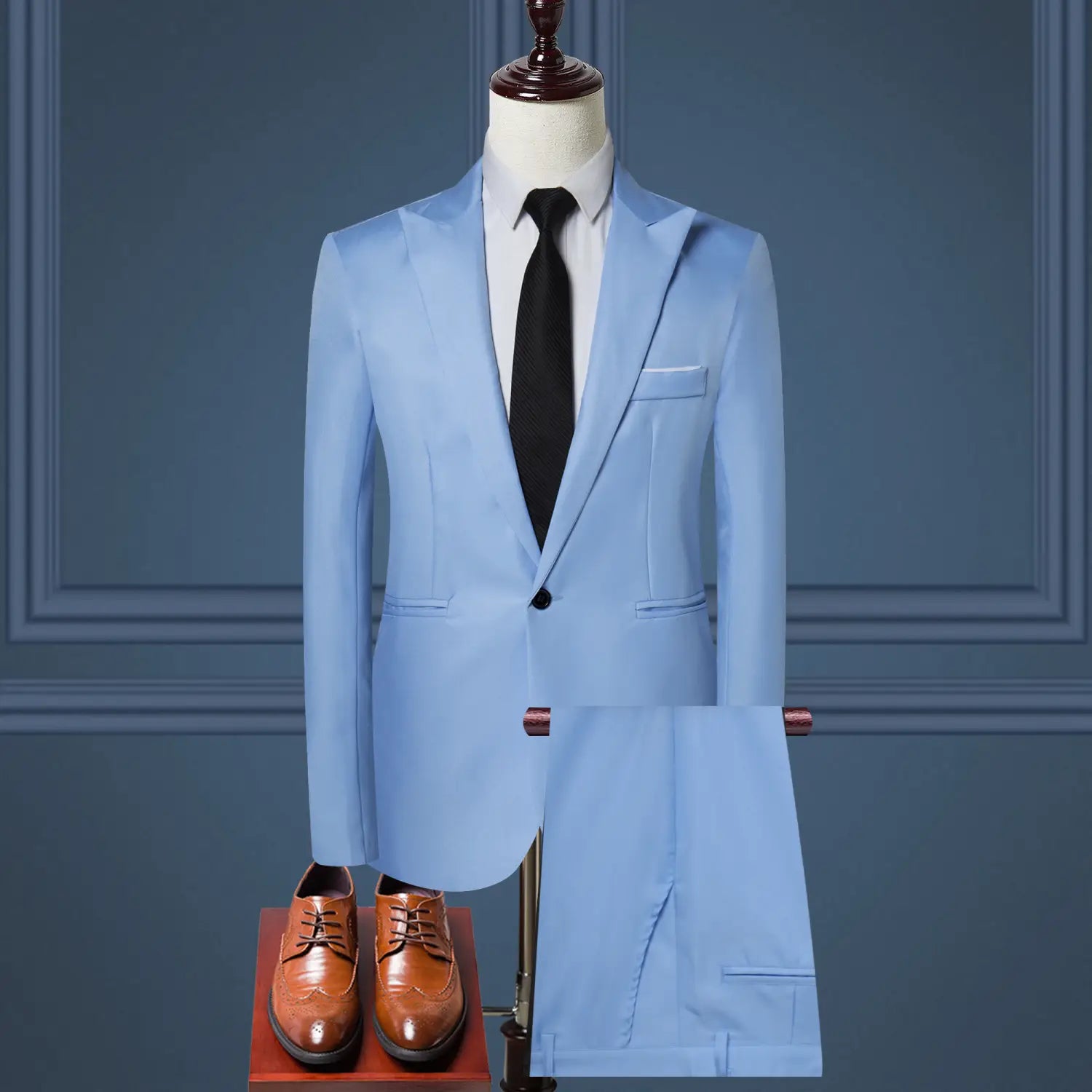 Light blue tailored men solid color two piece leisure suit featuring a jacket with notched lapels and a single black button displayed on a mannequin with matching trousers.