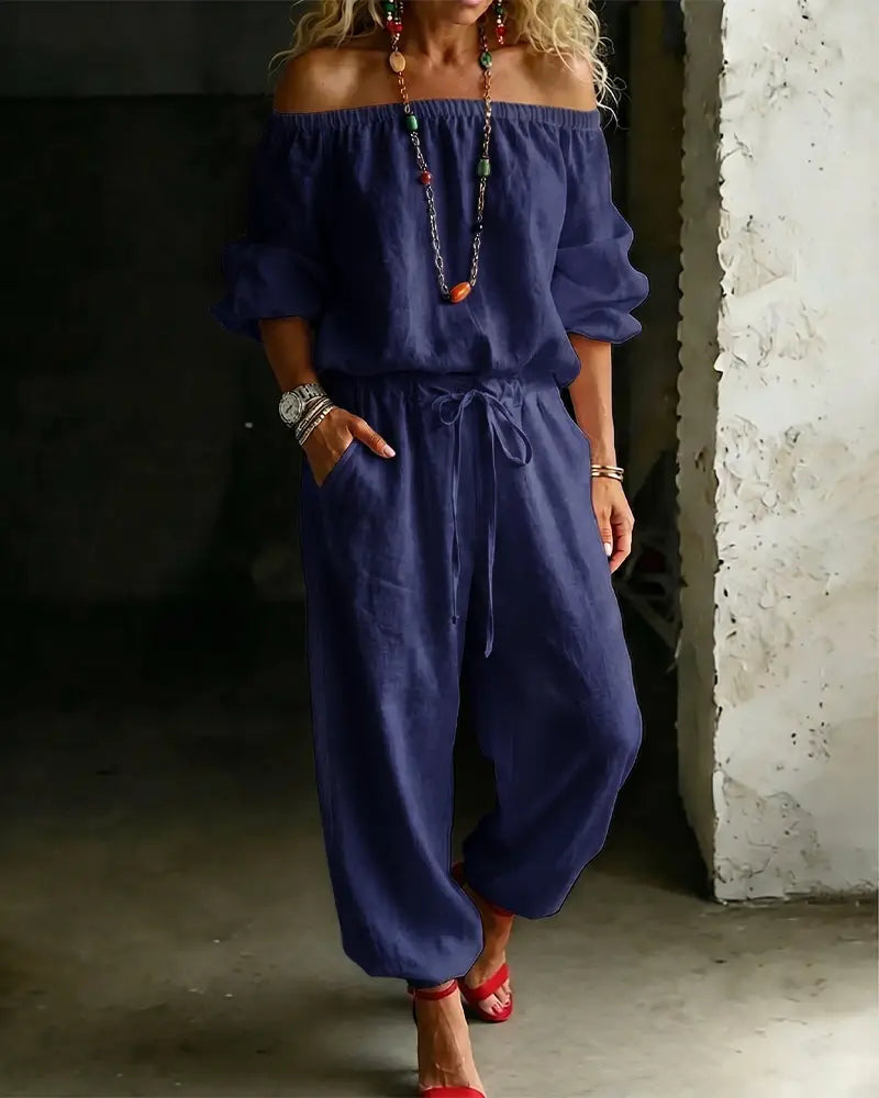 Navy blue off-the-shoulder linen jumpsuit set featuring a drawstring waist and loose fit for comfortable casual wear.