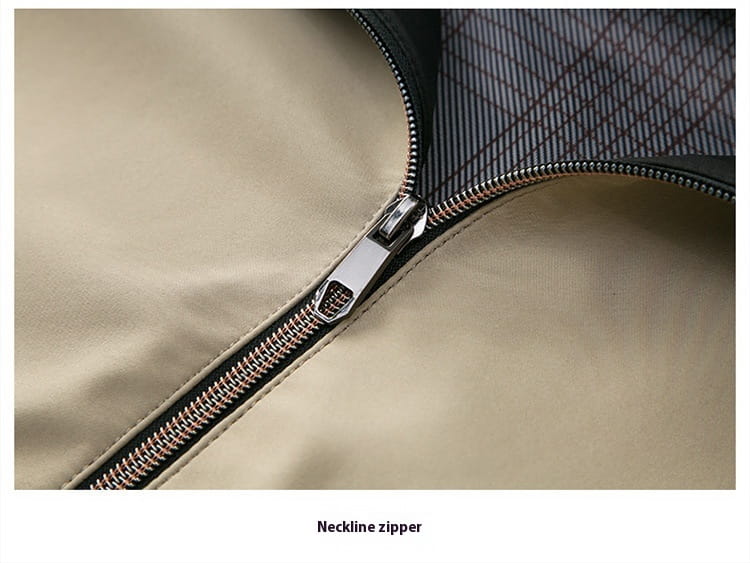 Silver-toned metal zipper with a sleek rectangular pull tab and interlocking teeth on the seam of a beige men casual polo bomber jacket.