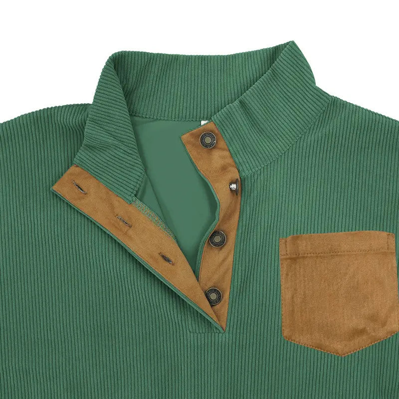 Slim fit corduroy pullover in green with tan suede collar placket and pocket featuring contrast accents.