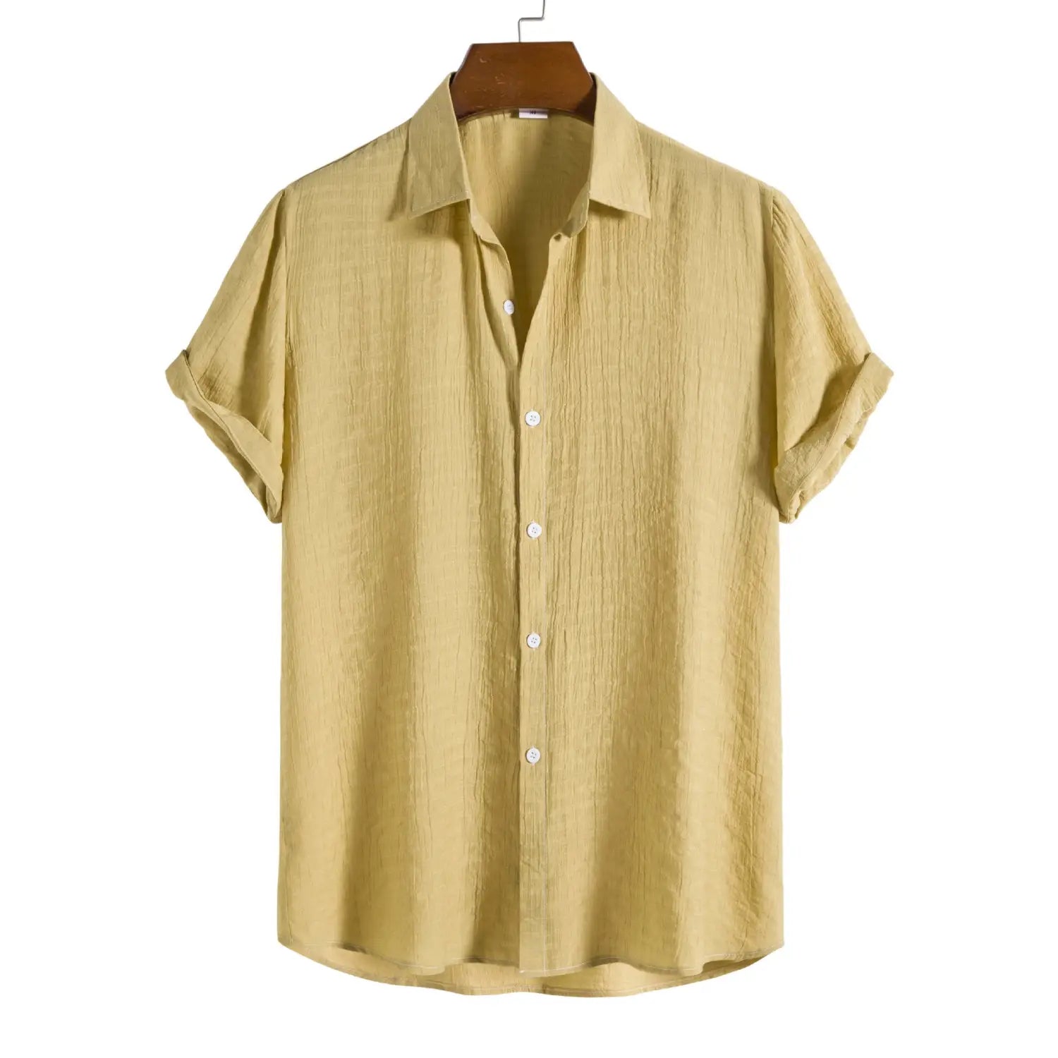 A light olive green men’s minimalist textured short sleeve grid shirt with a subtle textured fabric and rolled cuffs.