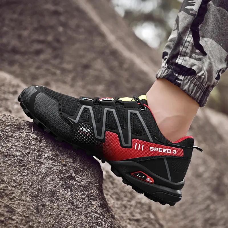 Men’s trail running shoes featuring a black and red breathable mesh upper, rubber outsole, and speed 3 branding on the side.
