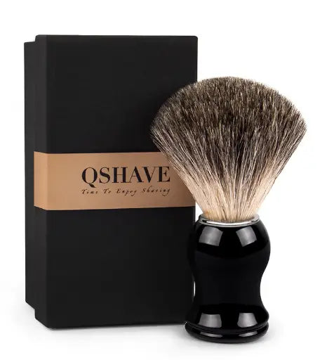 Black glossy handle badger hair shaving brush with dense natural bristle head featuring gradient from dark to light brown.