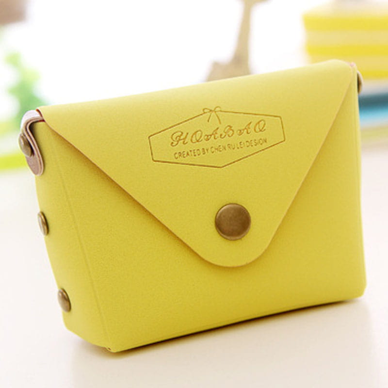 Bright yellow leather envelope style wallet with metallic button closure and decorative brass toned rivets from the Macaron Pastel Leather and PVC coin purse set.