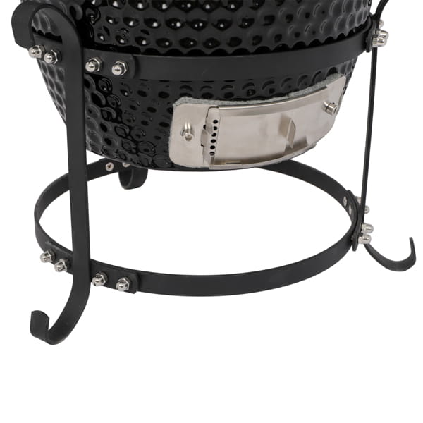 black ceramic 13 inch kamado charcoal grill with stainless steel access panel and metal stand viewed from the back side
