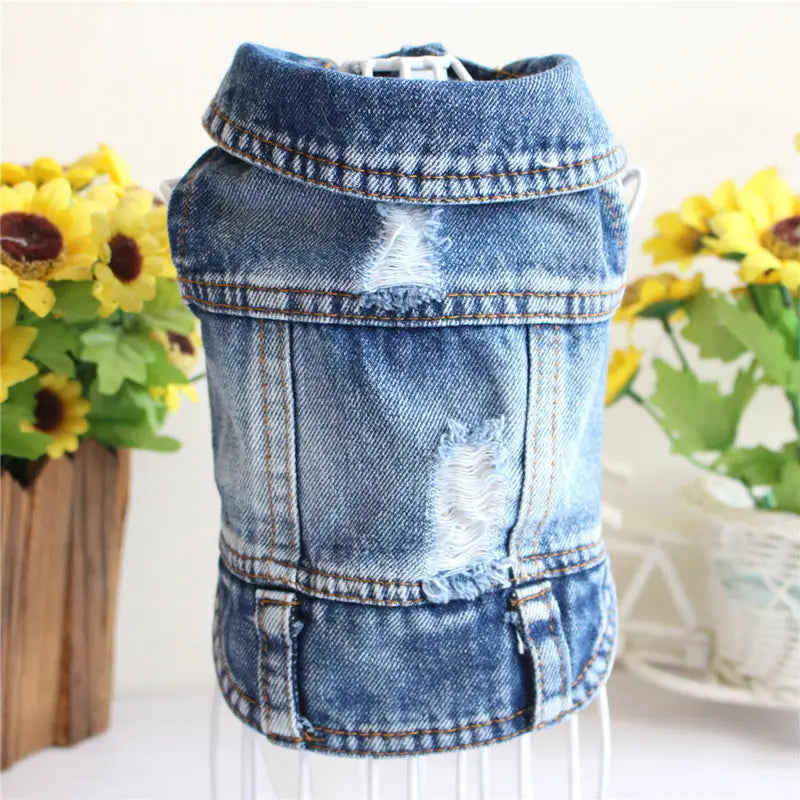 Blue denim dog vest with distressed patches and brown stitching for puppies featuring strawberry embroidery.
