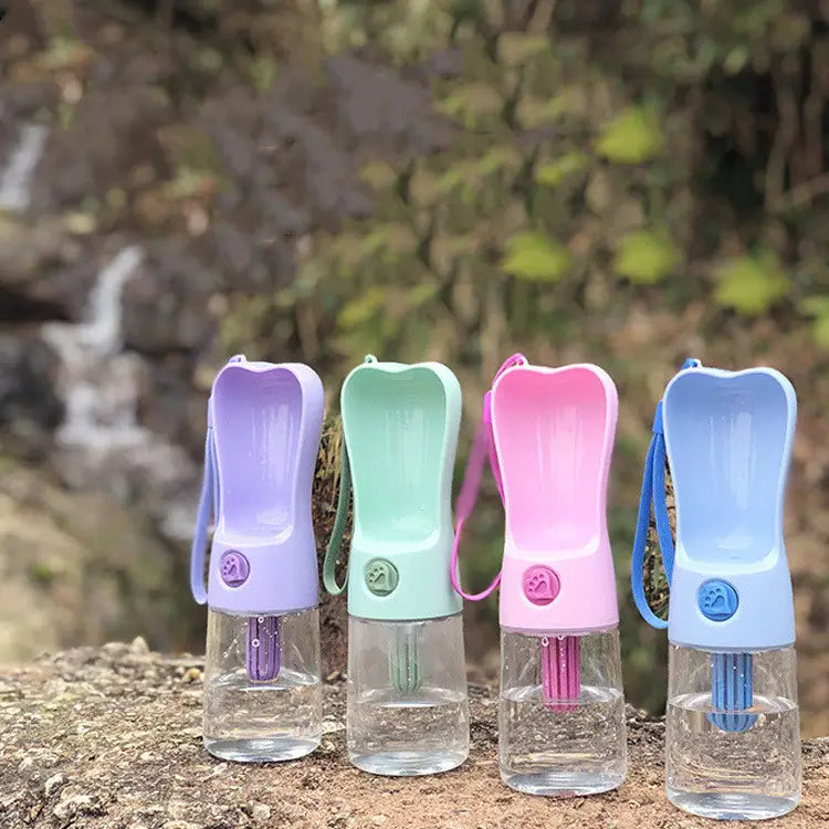 four colorful portable dog water bottles with activated carbon filters feature translucent bases matching tops handles and straw-like spouts for easy pet hydration on the go