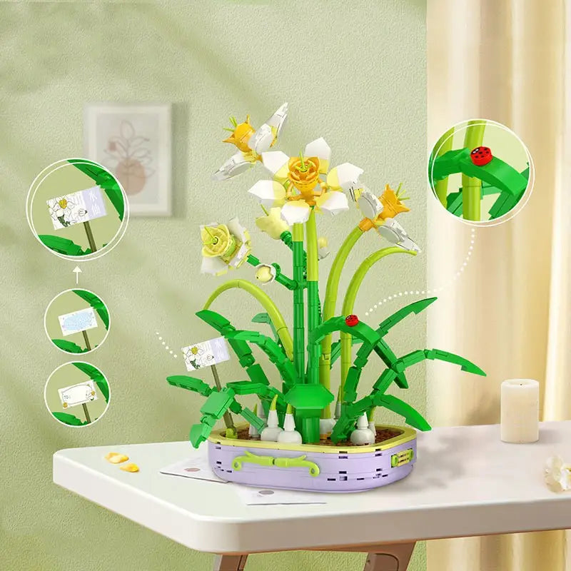 Un ensemble vibrant de fleurs en blocs de construction comprenant un bouquet floral violet assemblé avec minutie, des fleurs blanches et jaunes ainsi que des tiges vertes, présenté dans un pot lavande.