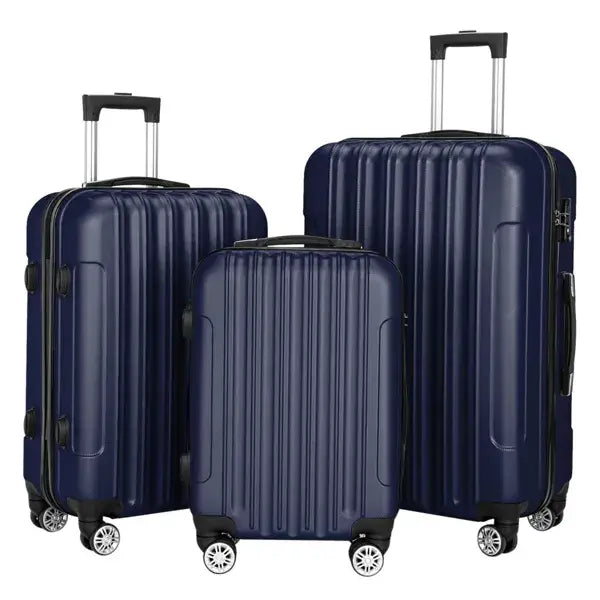 set of three navy blue hard shell spinner suitcases with vertical ribbed design and black wheels in a 3-piece hard shell luggage set