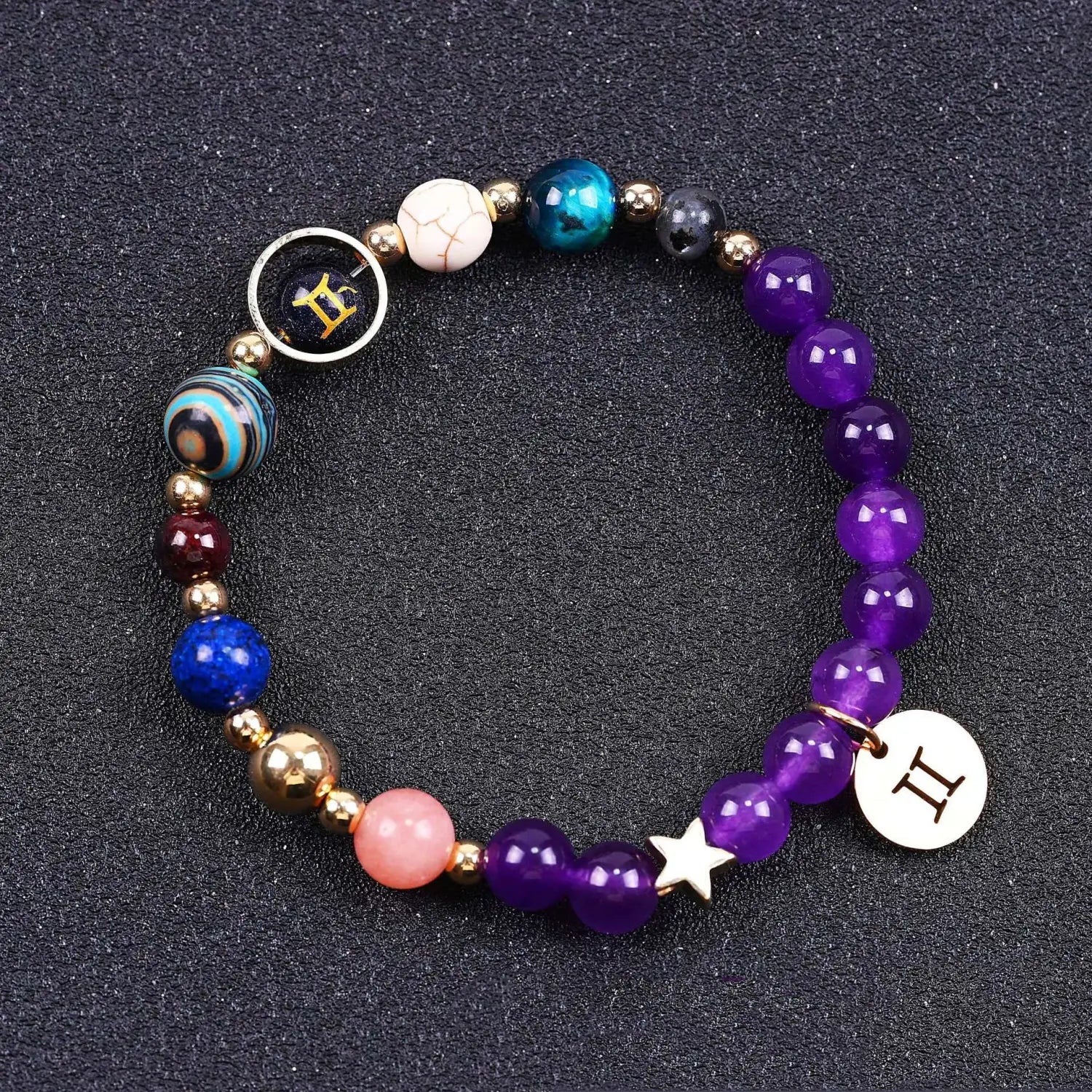 A vibrant purple natural amethyst and agate twelve zodiac beaded bracelet adorned with assorted blue teal white and pink beads accented by gold-toned spacers featuring a star charm and circular zodiac-themed pendants.