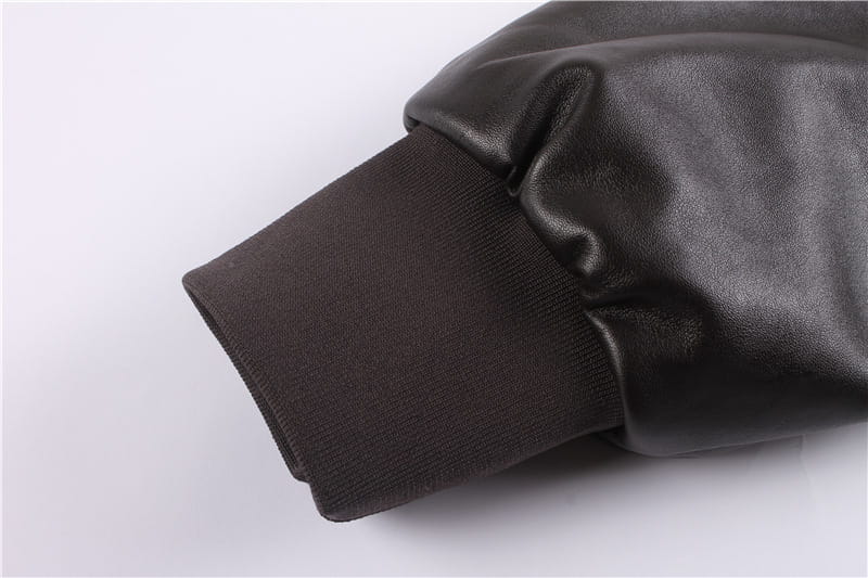 black leather sleeve with ribbed knit cuff on air force fur leather bomber jacket with flag lining
