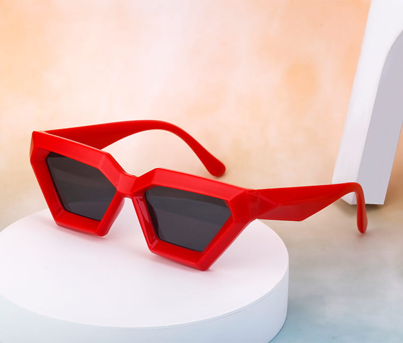 Modern irregular cat eye uv400 geometric sunglasses featuring vibrant red geometric frames with dark gray lenses.