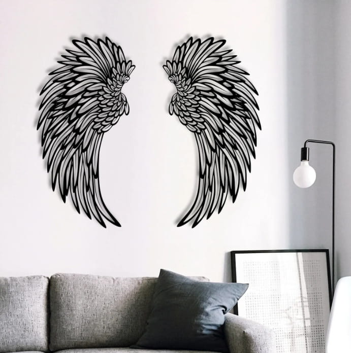 black metal angel wings wall decor with intricate feather detailing and led lights for indoor decoration.