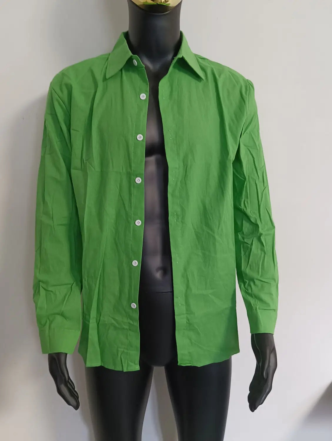 Bright green mens cotton long sleeve casual button down shirt with classic collar and white buttons.