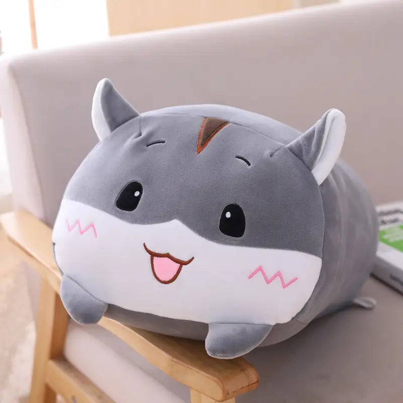 Gray and white plush hamster pillow with pink zigzag cheeks black eyes and a smiling tongue soft cartoon doll designed for kids.