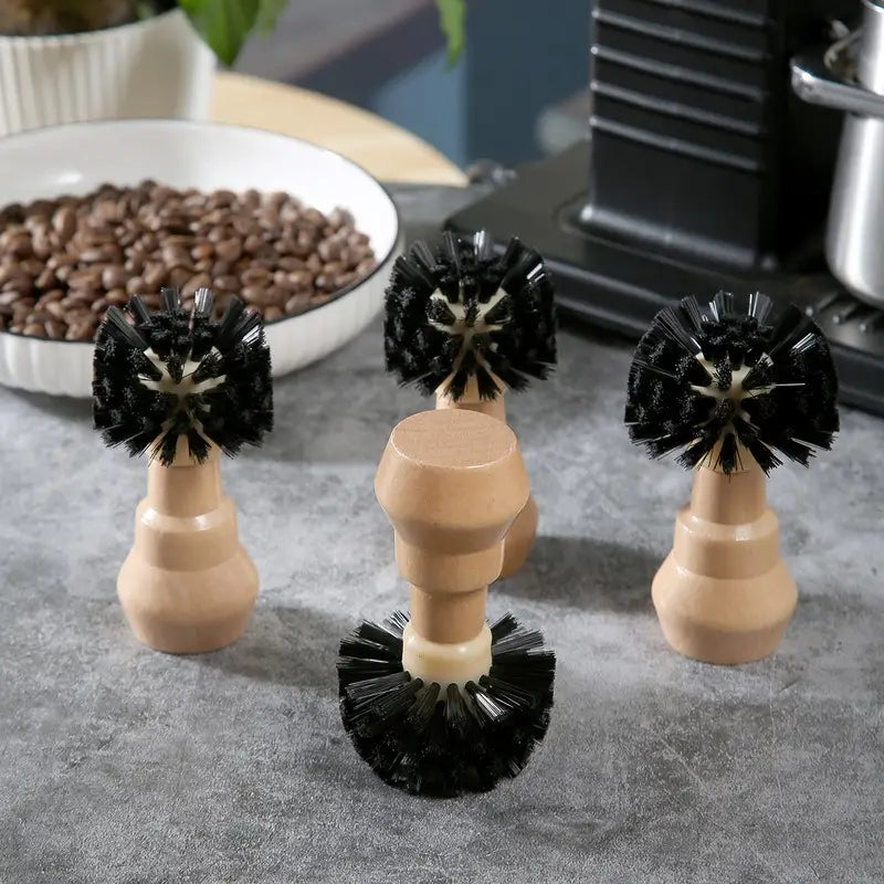 Set of four coffee machine cleaning brushes with black bristles and wooden ergonomic handles for durable and efficient cleaning.