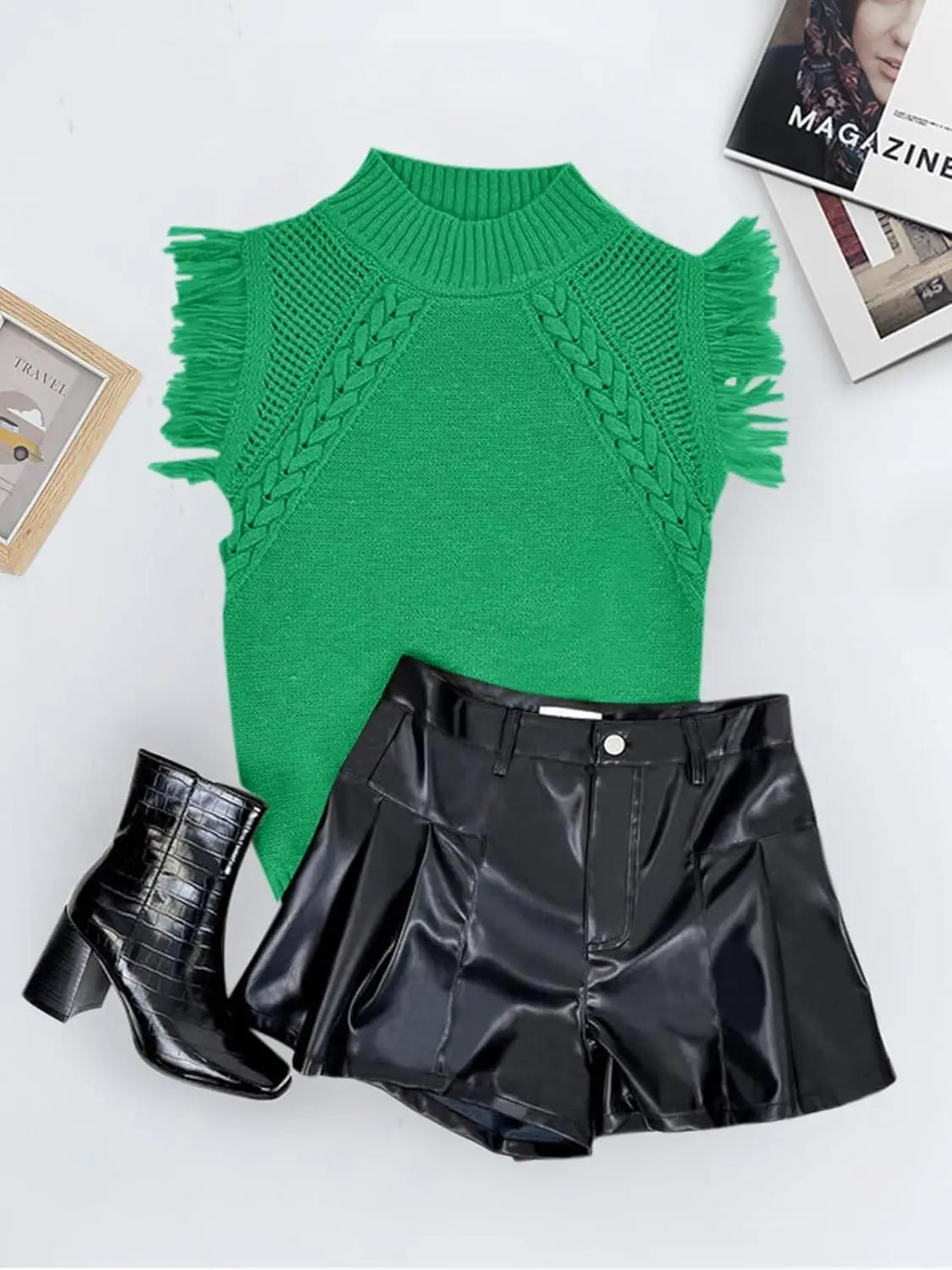 Vibrant green hand-woven fringed sleeveless knit sweater vest featuring a high neckline and braided cable-knit pattern.