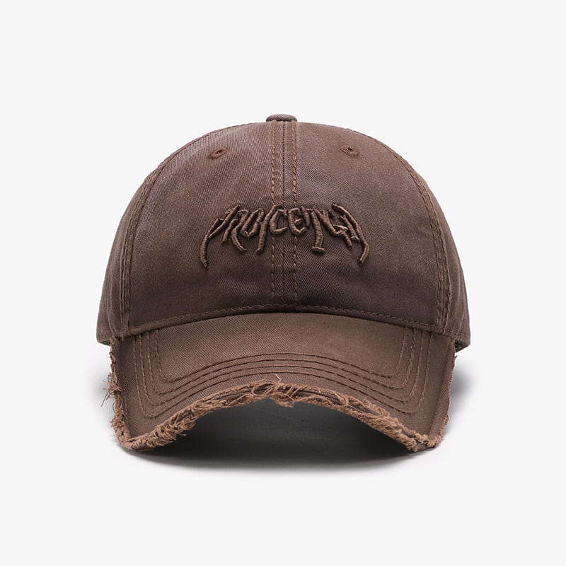 Brown distressed cotton baseball cap featuring an embroidered pruccenga logo on the front.