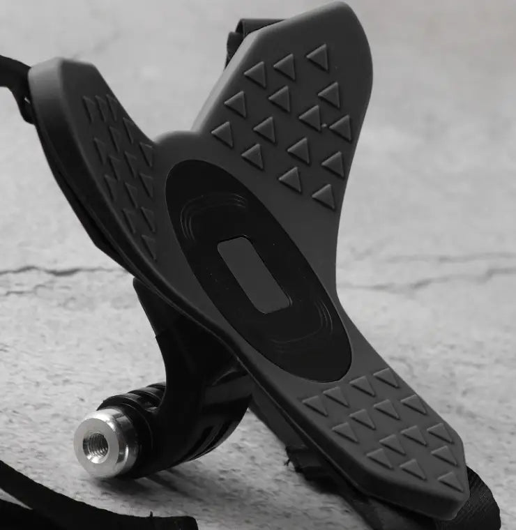 black rubberized grip with triangular texture and central oval cutout attached to metallic threaded base for gopro helmet chin mount compatible with dji hero 7 6 5