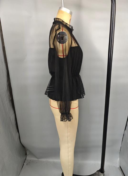 black sheer ruffled peplum blouse featuring a mesh top with ruffled sleeves and hemline displayed on a mannequin