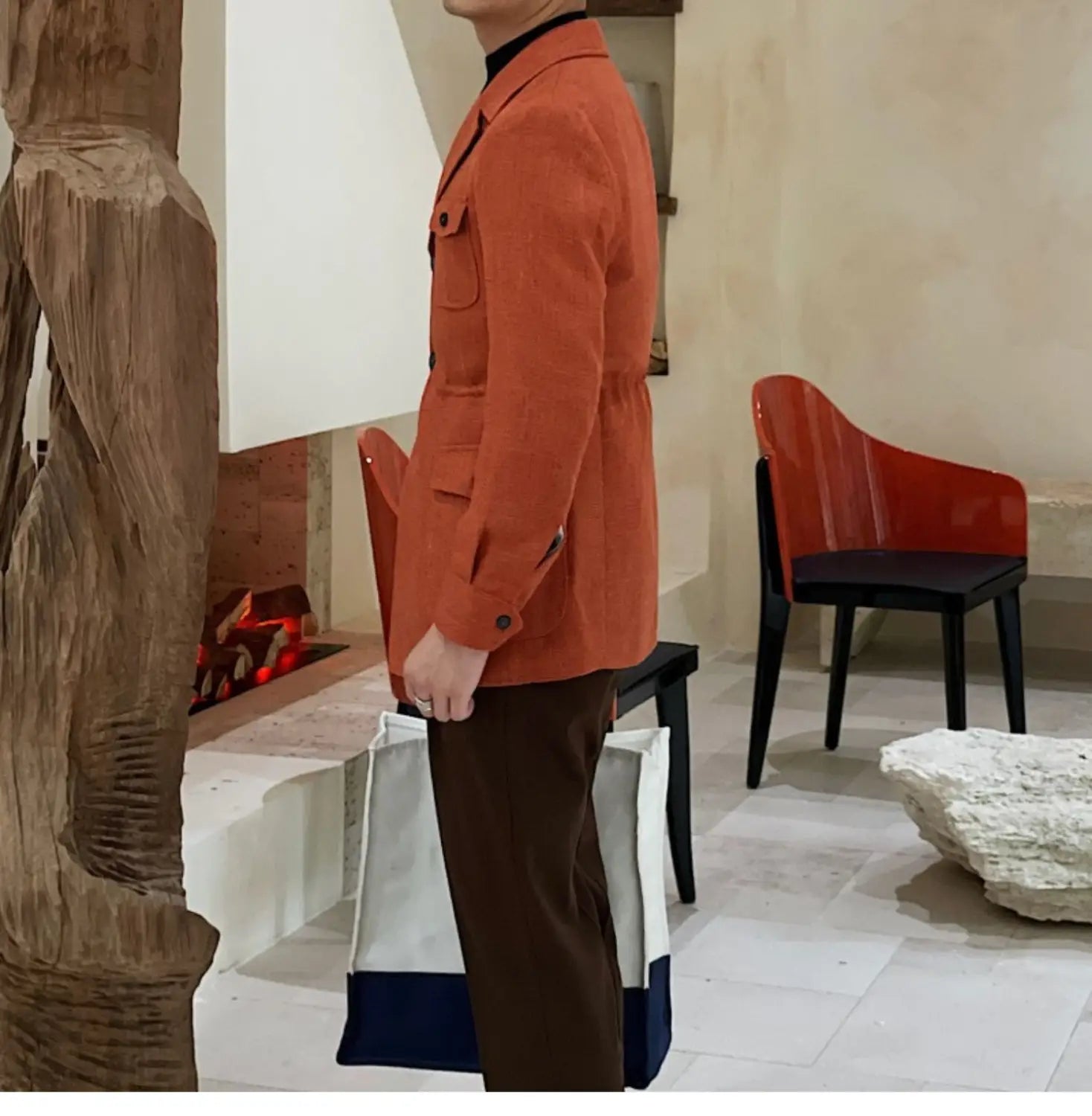 Veste de blazer en laine ceinturée ajustée slim fit pour homme, texture orange, avec bordure noire et poches à rabat.