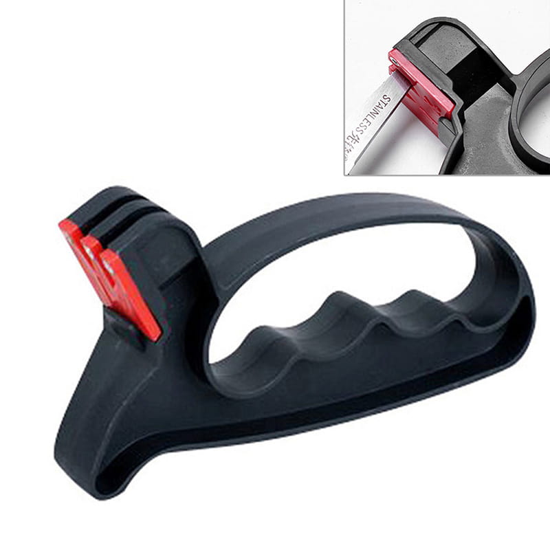 Black plastic knife sharpener with red abrasive inserts and textured grip designed for knife and scissor sharpening in the kitchen.