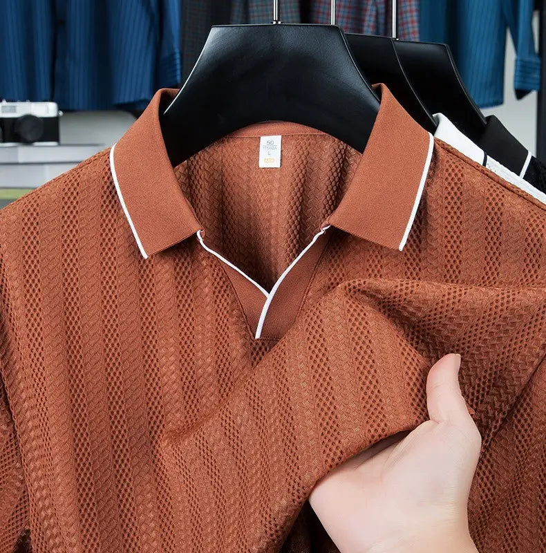 Men’s rust-colored textured ice silk polo shirt featuring a knit pattern with white trim along the collar and placket.