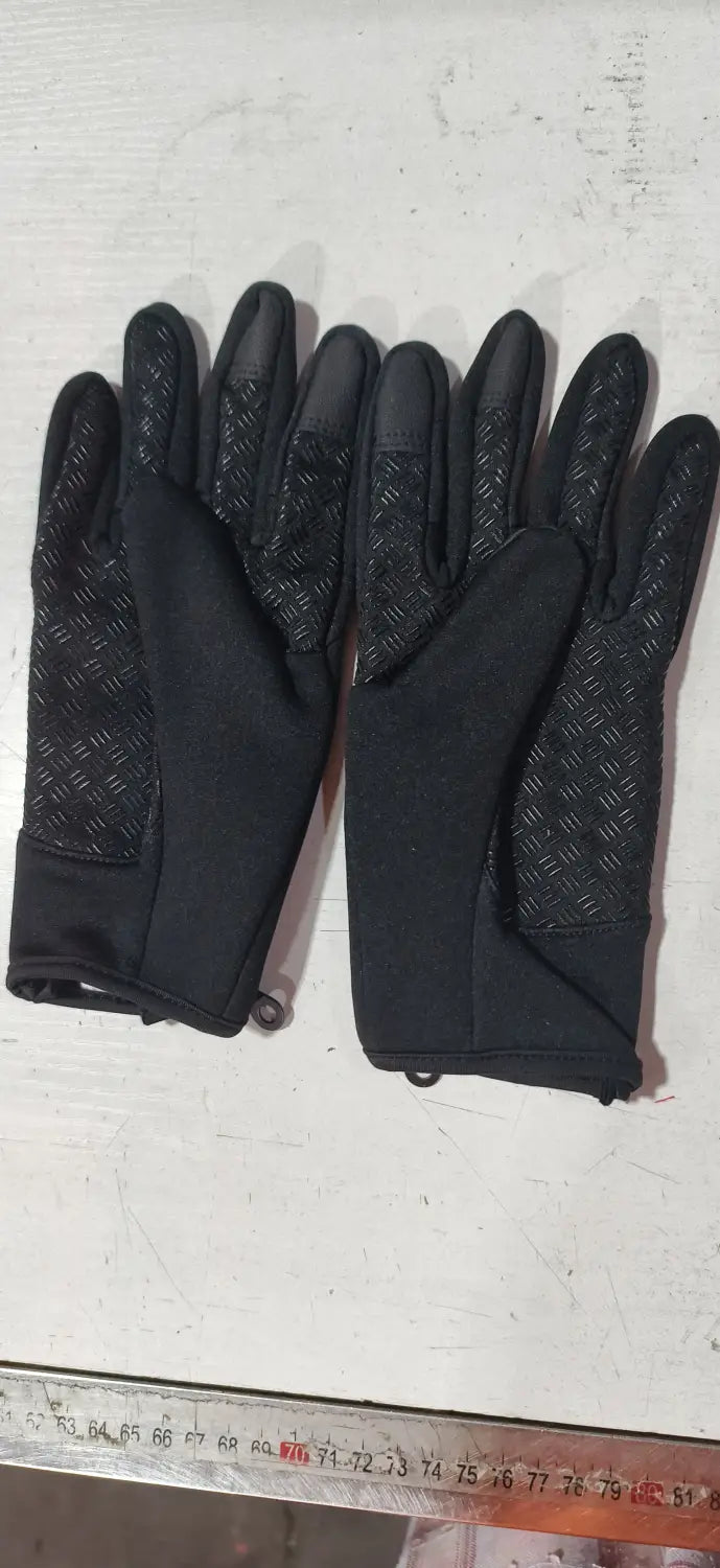 Black windproof touchscreen winter gloves with textured grip panels on the fingers and palms for men and women.