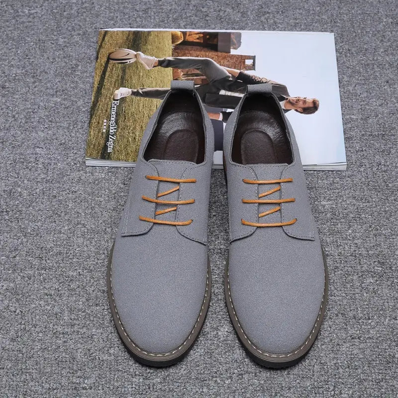 Men’s plus size British style suede casual Oxford shoes in gray canvas with tan laces and black rubber sole.