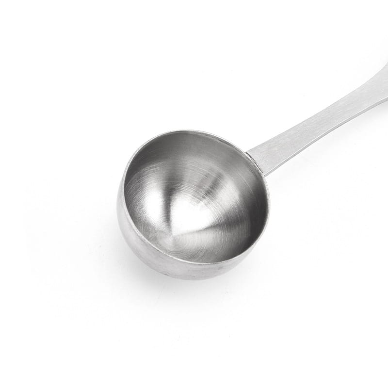 A sleek stainless steel measuring spoon with a polished finish and slender handle made from 304 stainless steel for kitchen use.