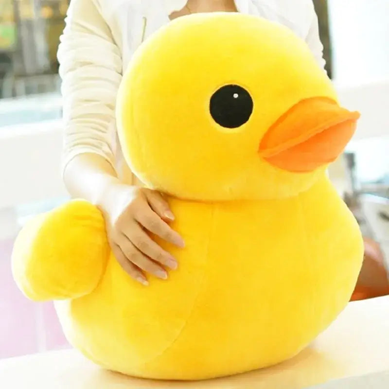 Ein flauschiges gelbes Gummienten-Weichstofftier mit schwarzem Auge und orangefarbenem Schnabel, erhältlich in Größen von 20 bis 50 cm.