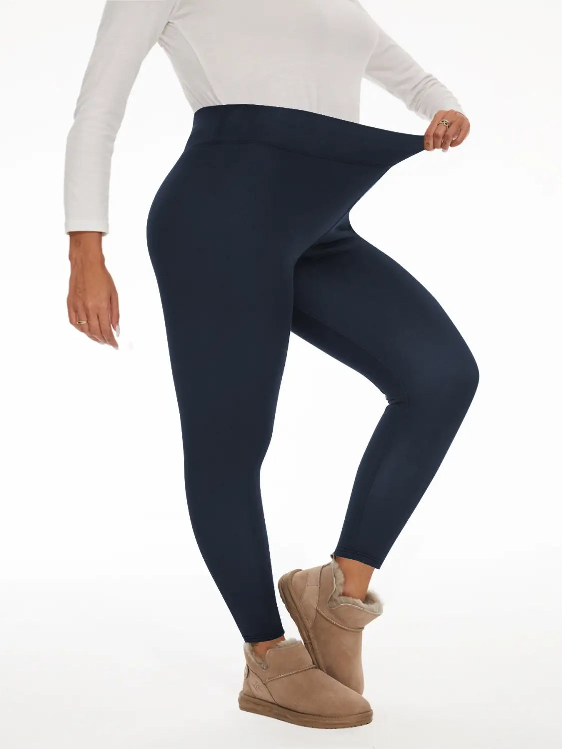 navy blue fleece lined high waisted winter leggings made of stretch material shown from the back side