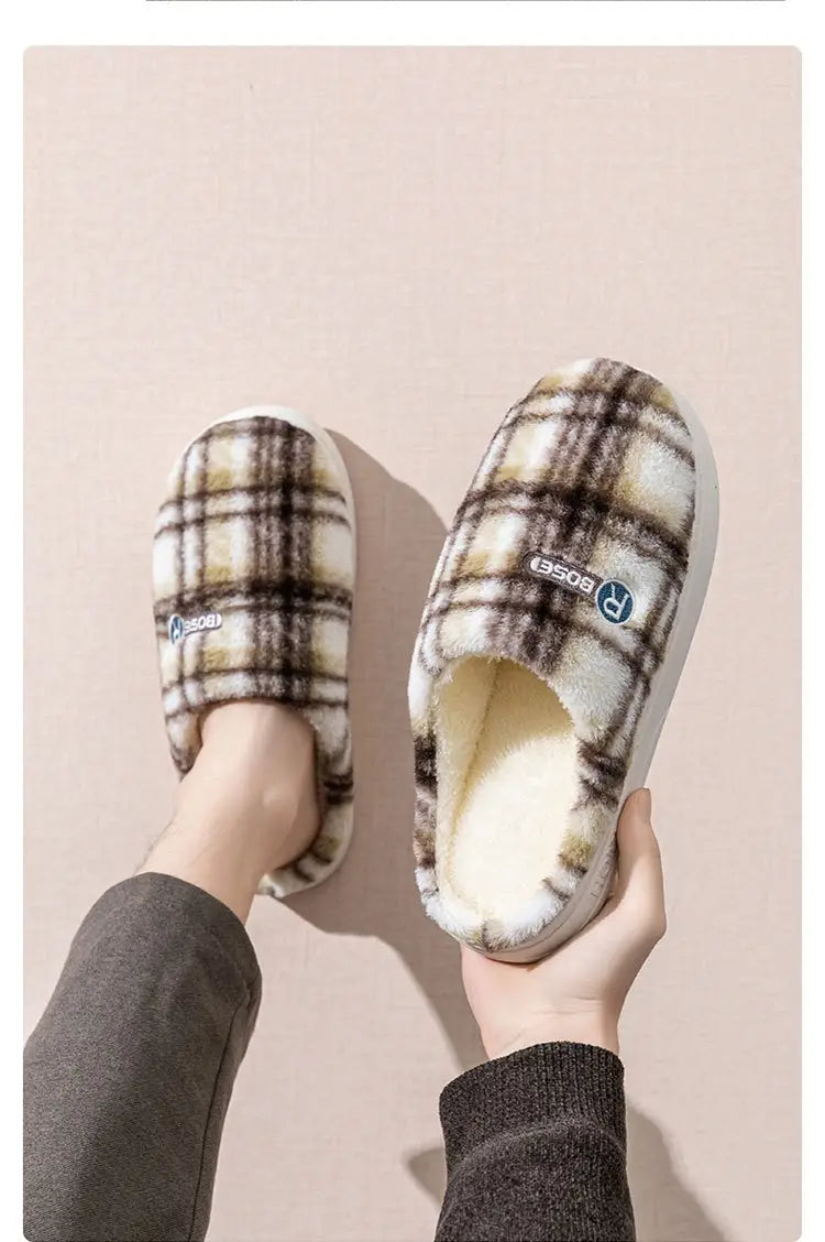 Unisex plaid fleece lined non slip indoor slippers with a soft fluffy interior and white soles.