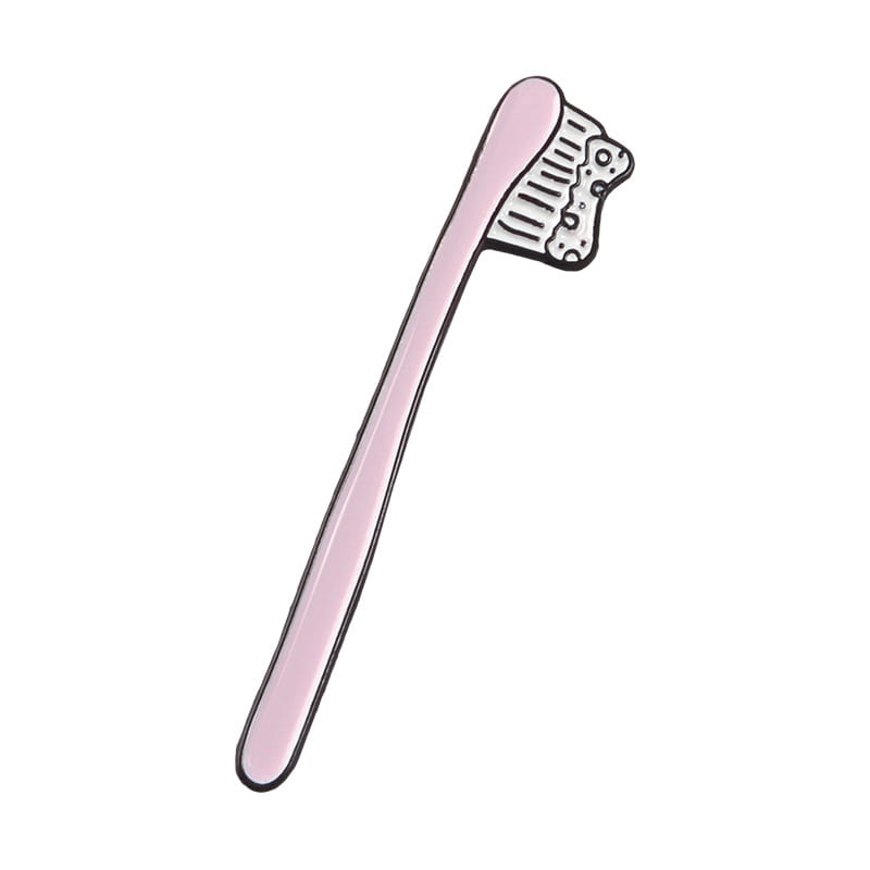 pink enamel pin shaped like a toothbrush with white bristles and black outlines from the toothpaste smile enamel pin cartoon tooth brooch collection