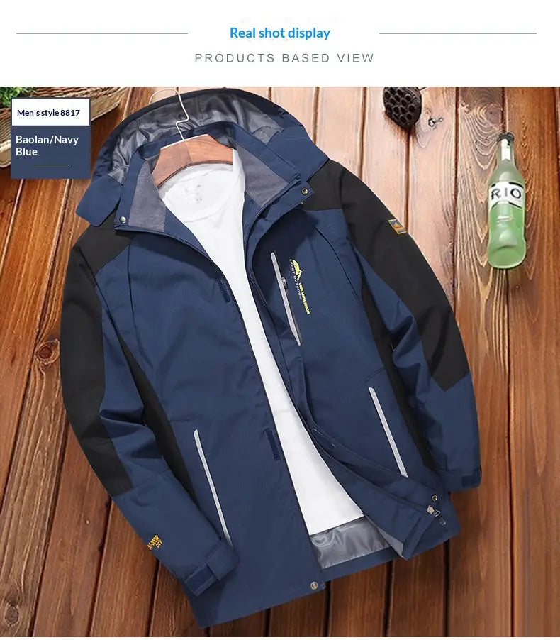 veste coupe-vent de randonnée imperméable pour hommes en bleu marine et noir, avec tirettes de fermeture réfléchissantes, conçue pour un usage en extérieur.