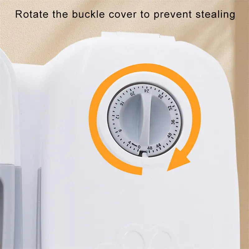 White plastic timer with a circular 24-hour dial and an orange rotation arrow on the back of an automatic pet feeder gravity waterer and food dispenser