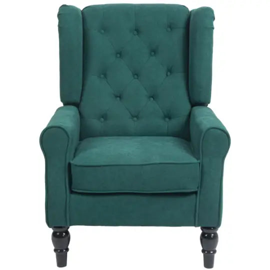 Fauteuil d’appoint en velours vert émeraude capitonné avec dossier « wingback », et pieds en bois foncé.
