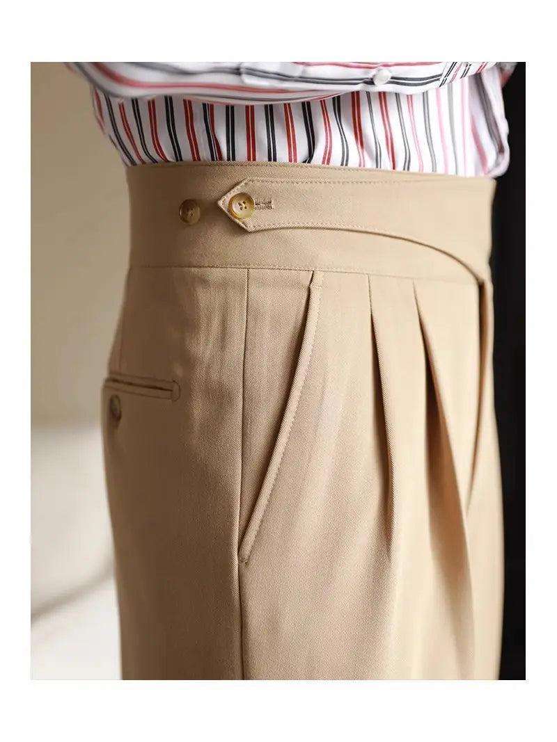 Men’s tailored pleated wool straight leg trousers in beige featuring a structured waistband with gold-tone button details.
